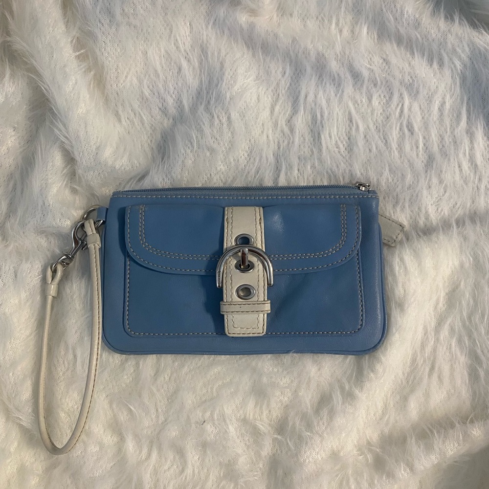 Coach Wristlet blue and white inside in excellent condition! Has outside flap